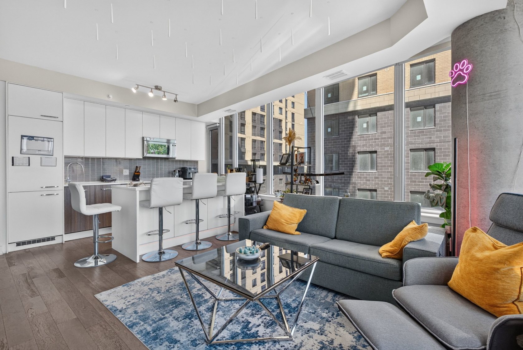 111 Champagne Ave S 307 living room with panoramic city views